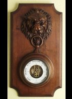 Wooden case with carved lionhead.