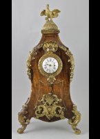 Antique french watch stand with front of an antique oignon watch. ca 1730