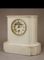 White marble mantel clock by Achille Brocot with a year+ going movement with visible Brocot-escapement and rubin pallets. 
The movement has 5 serial connected barrels for the long duration. Full winding takes 84 half keyturns. 

high: 36 cm 
wide: 37 cm 
deep: 17 cm 
