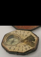 Large brass pocket sundial in original box with adjustable gnome and changeable magnetic declination hand under the compass needle. 96 x 83 mm