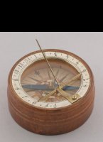 Wooden sundial with silvered brass hour-ring, copper engraving as windrose, brass gnome. Original paper box with ink written year 1780 on it and some Declination instructions. Box 60 x 23mm.